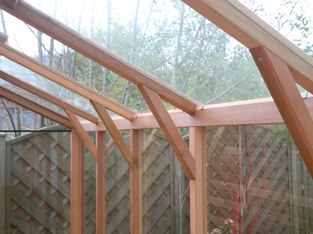 Detail shot of the eaves framing of the Alton Fusion Greenhouse Shed with support angles