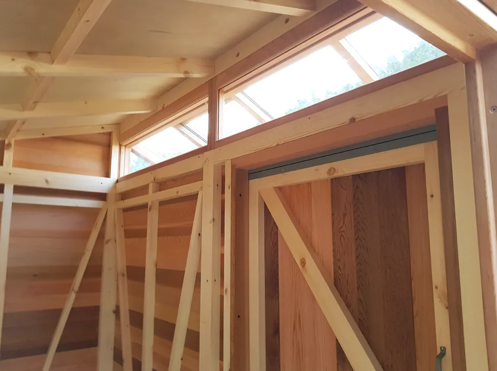 Interior shot of the shed with the glass windows above the internal sliding door