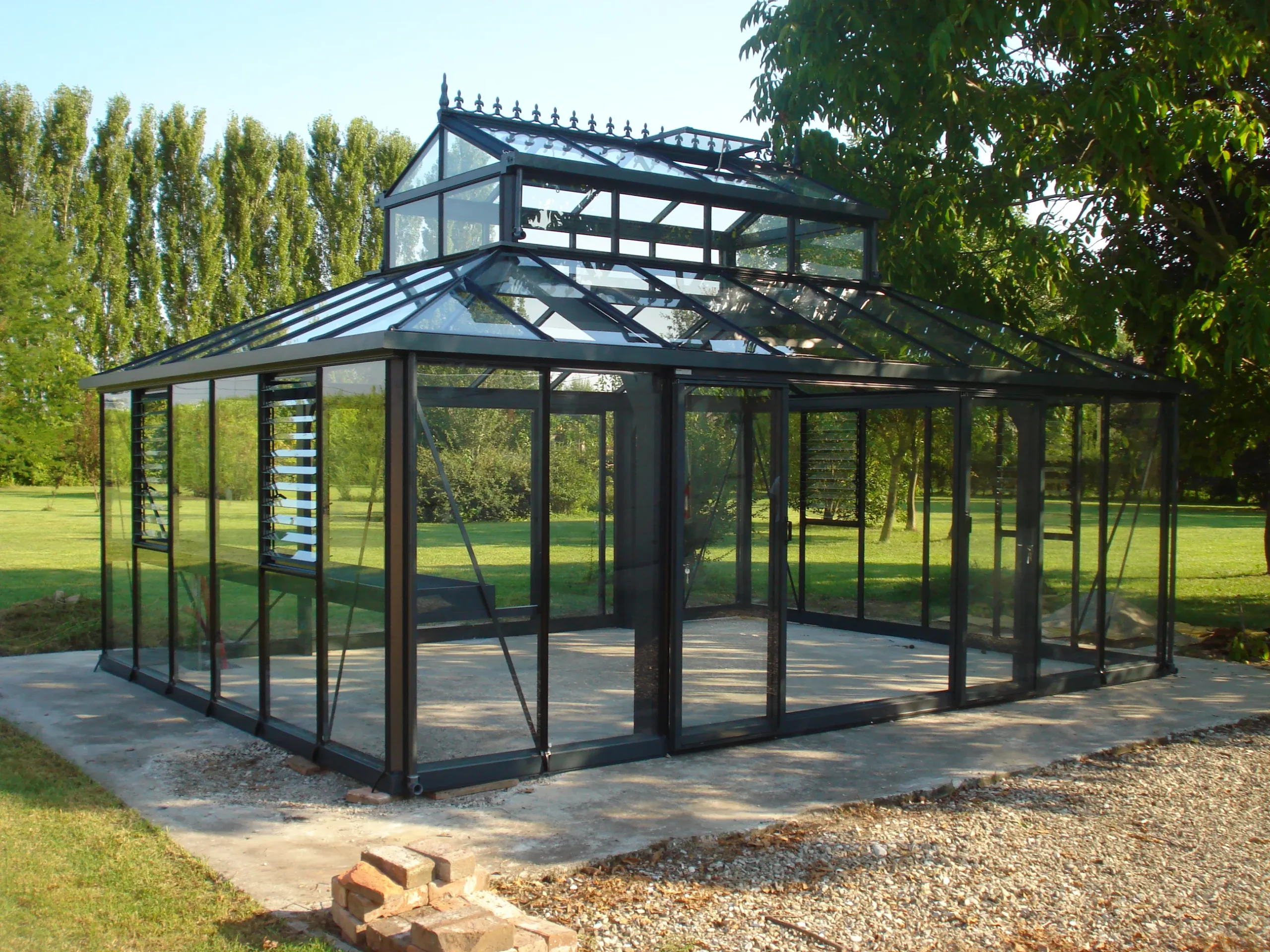 Exterior of the Janssens Cathedral Glass Greenhouse in Black, inside empty