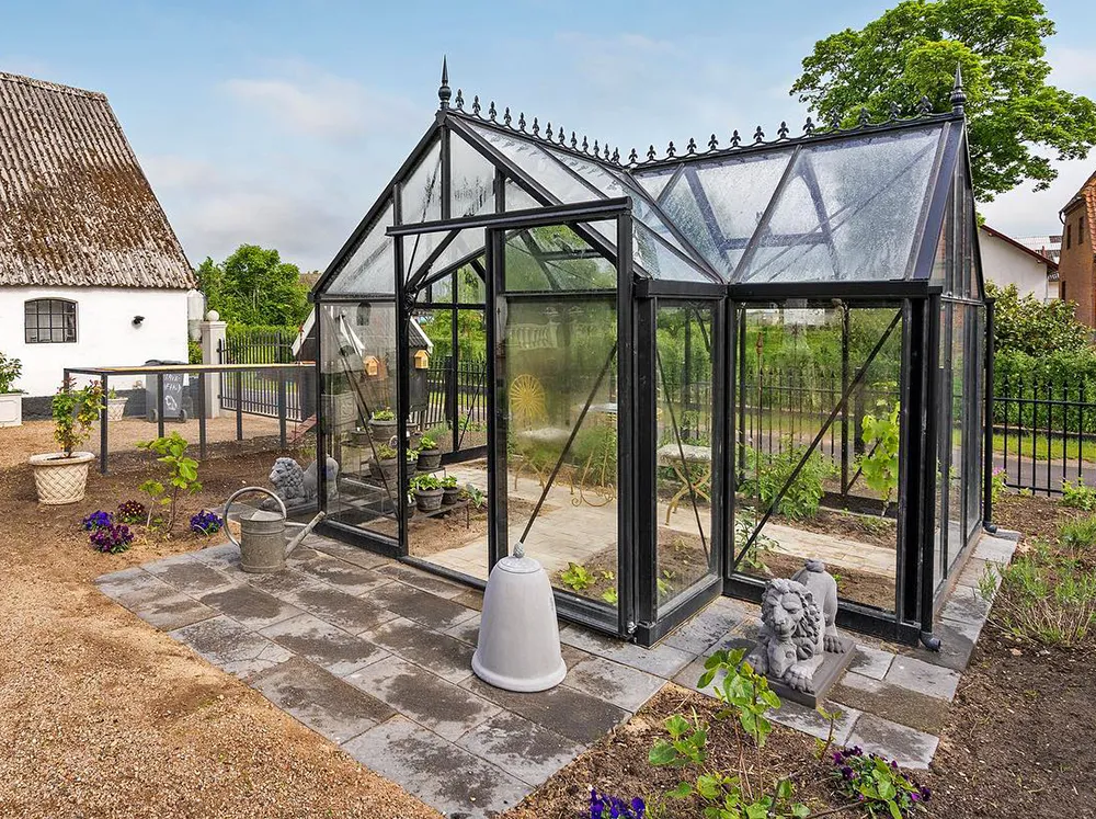 Exterior shot of the Janssens Junior Victorian Orangerie in a backyard