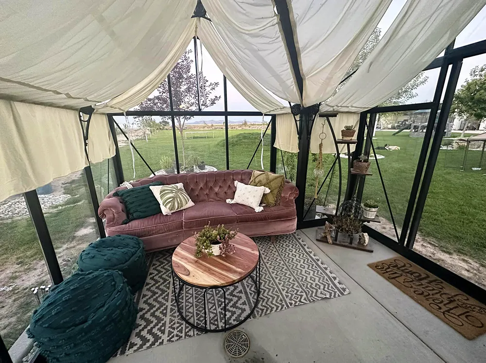 Interior of a Janssens Junior Victorian Orangerie with a couch