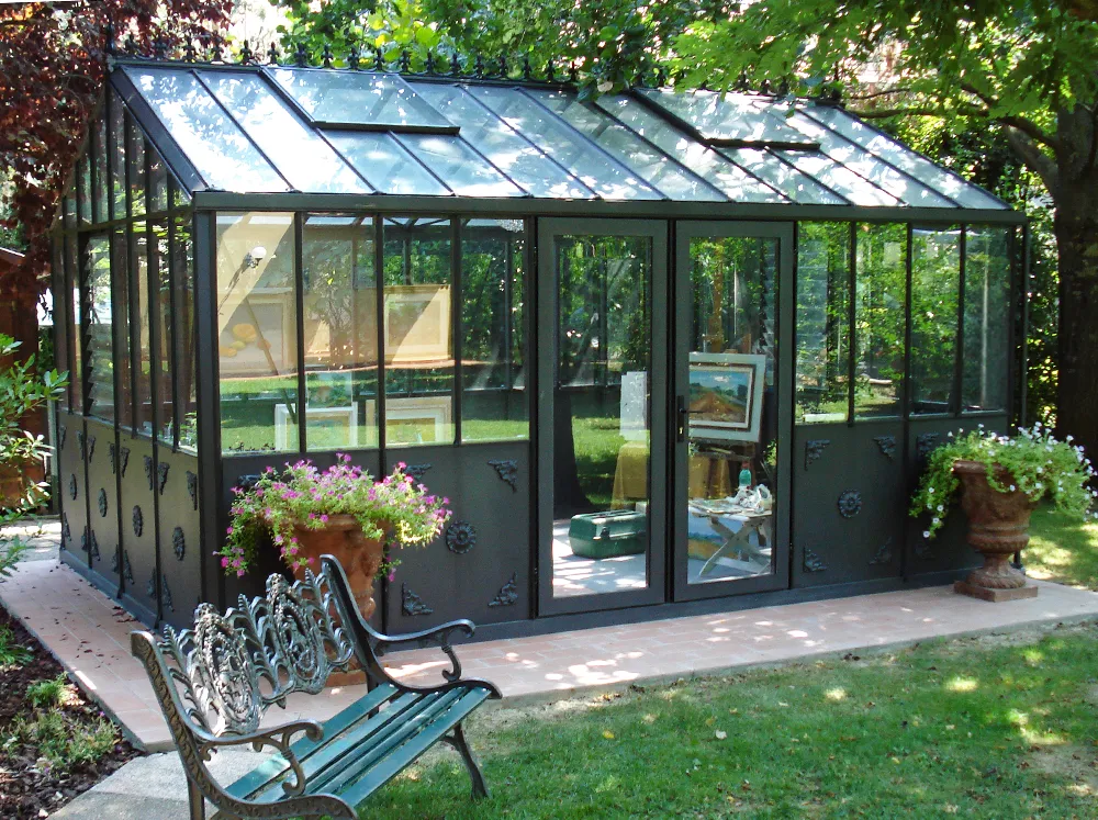 Janssens Retro Victorian Greenhouse in a backyard with art studio inside