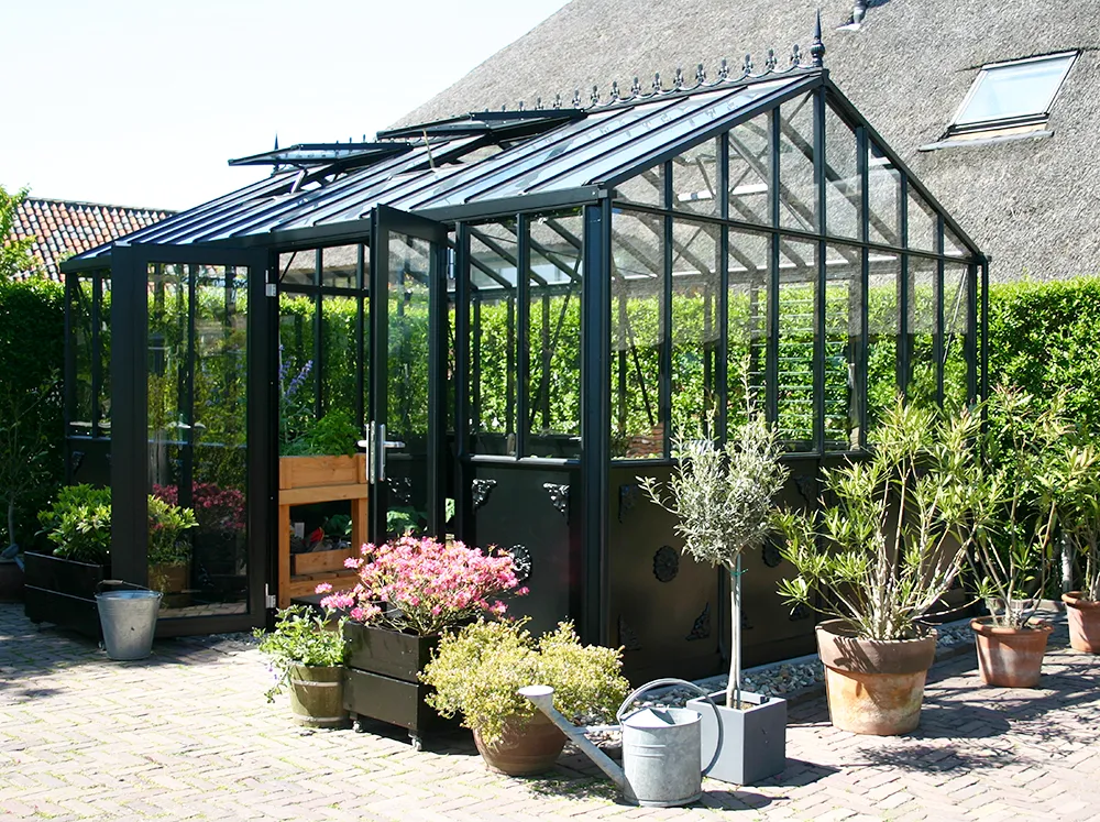 Side view of the classic Janssens Retro Victorian Greenhouse in Black with half-boarded aluminum panels