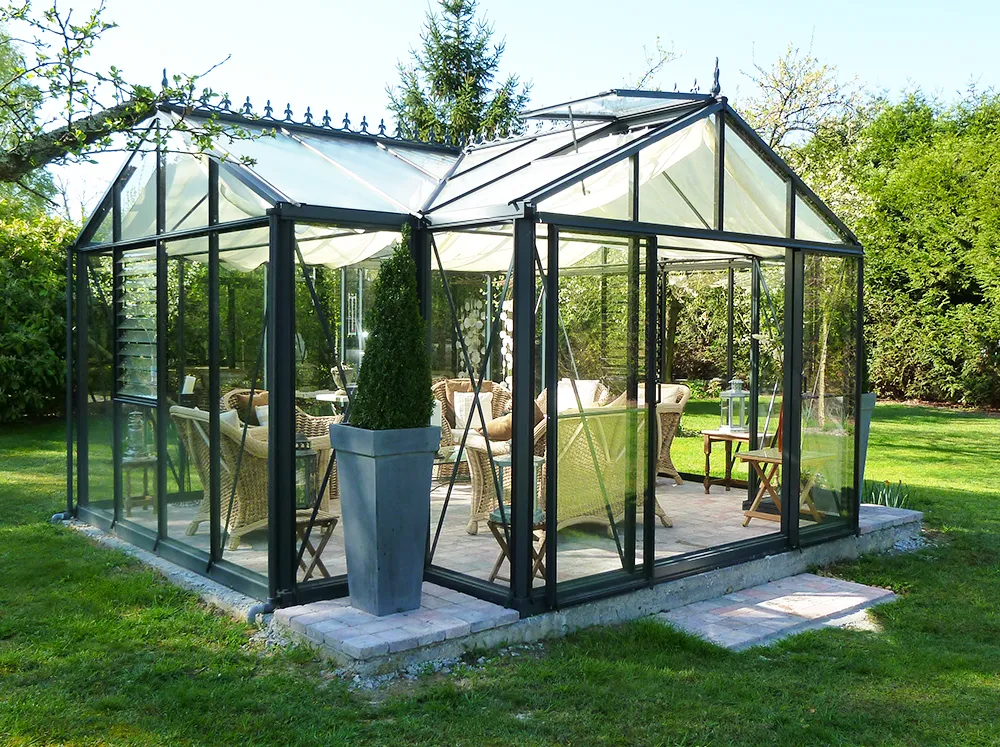 Front view of a Janssens Royal Victorian Orangerie with seating inside