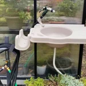 Sink system installed on the exterior of a MONT Greenhouse