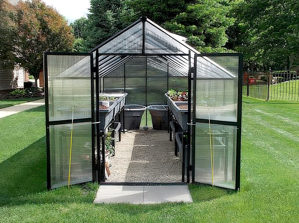 Front exterior view of Mont greenhouse with doors open