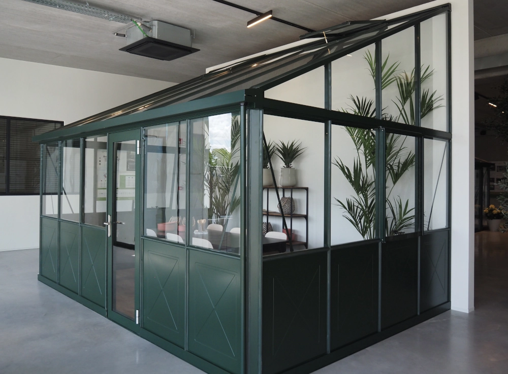 Janssens Arcadia lean-to greenhouse in a showroom. 