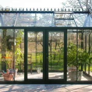 Janssens glass greenhouse with the Janssens Door Centering Kit installed on a double hinged door