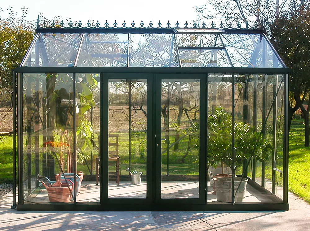 Janssens glass greenhouse with the Janssens Door Centering Kit installed on a double hinged door