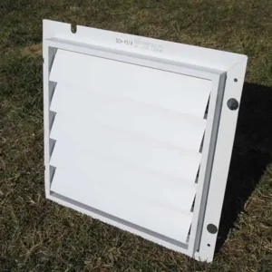 Outer side of the RSI Greenhouse Exhaust Fan System sitting on a lawn