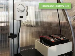 Thermostat and battery box included in the Exaco Solar-Powered Greenhouse Exhaust Kit