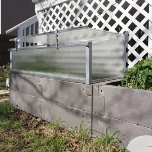 Juwel Kombi Raised Bed & Cold Frame in a backyard with the lid open