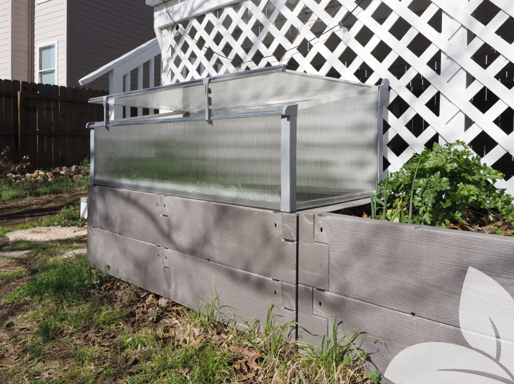 Juwel Kombi Raised Bed & Cold Frame in a backyard with the lid open