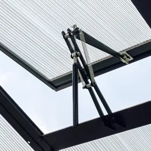 Interior view of a Vego Auto Vent Openers installed on a roof vent - open position