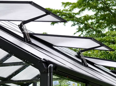 Exterior view of the Vego Auto Vent Openers installed on two roof vents