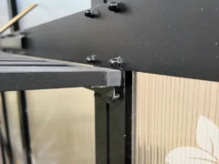 Close-up of the hinge on the Vego Foldable Shelf that allows it to fold flat against the wall