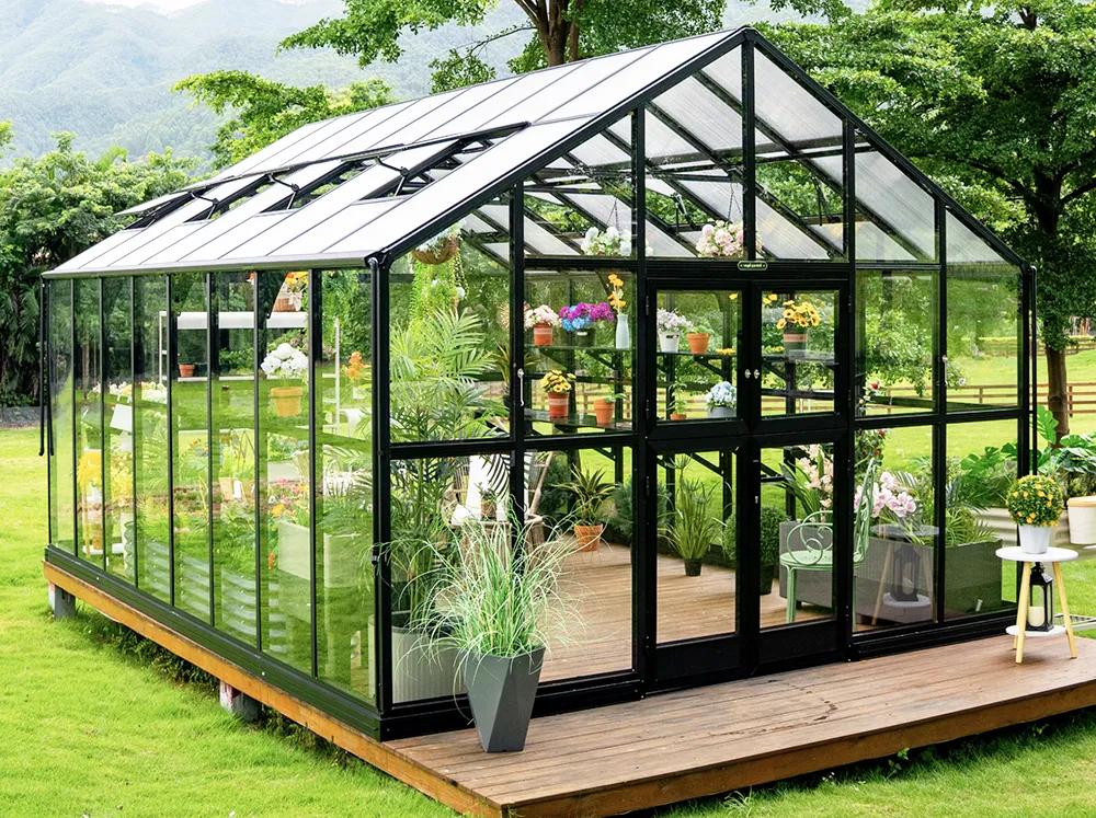Front of the Vego Grand Victorian Greenhouse with glass on the walls and polycarbonate roof