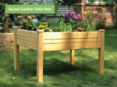 Eden Raised Garden Table with plants inside in a backyard