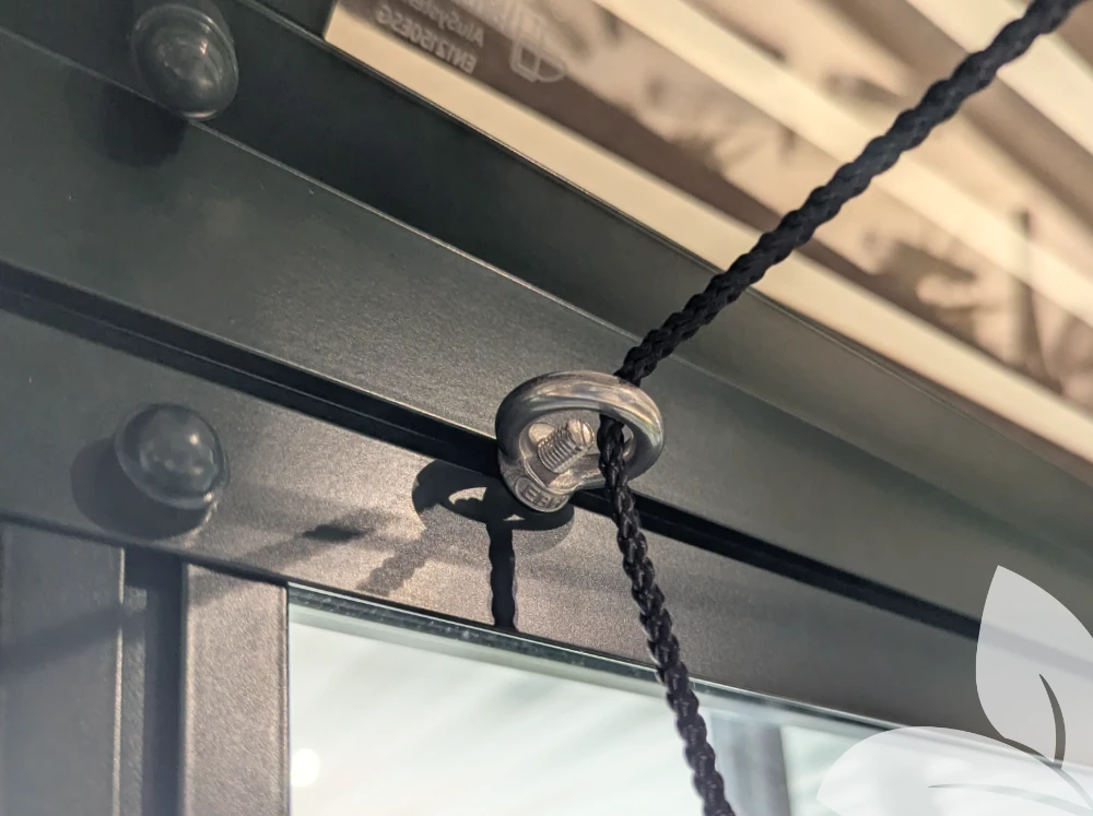 Eye Ring Hook installed in greenhouse with a string running through it