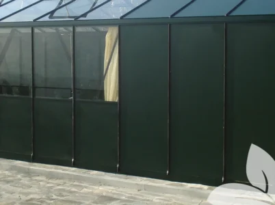 Janssens Painted Aluminum Wall Panels installed in a greenhouse - green half and full panels