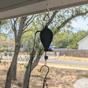 Plant Caddie Retractable Plant Pulley hanging from a hook
