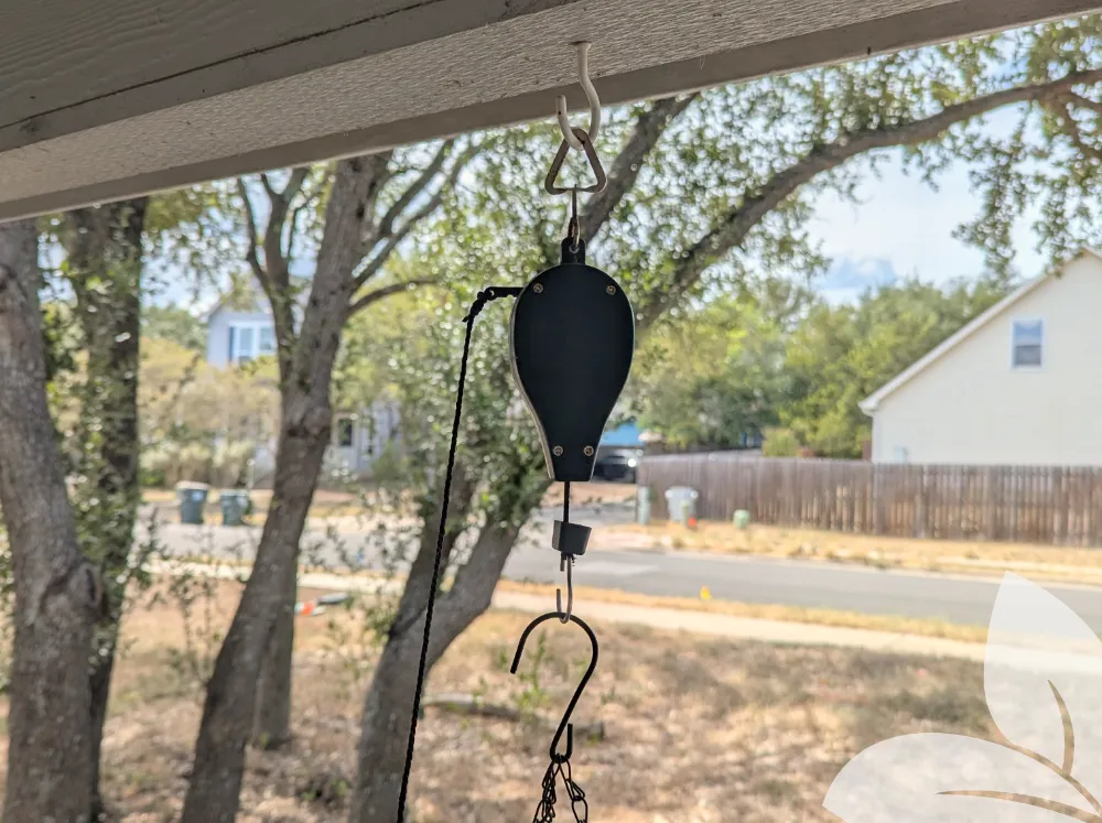 Plant Caddie Retractable Plant Pulley hanging from a hook