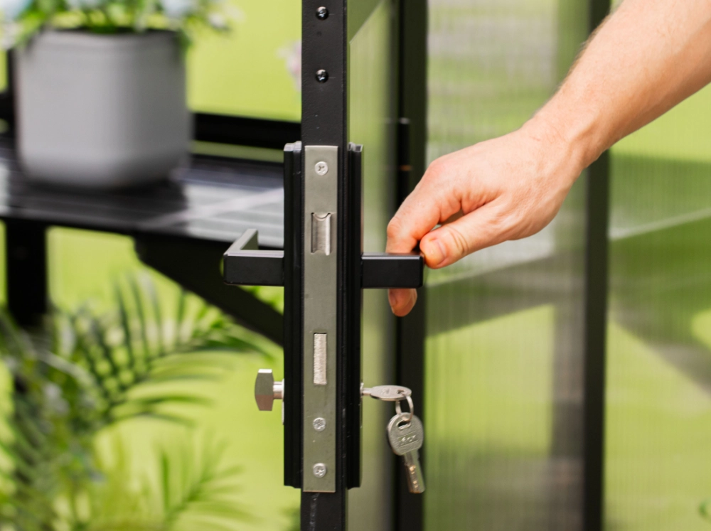Close-up of the door handle of the Vego Lean-To Greenhouse